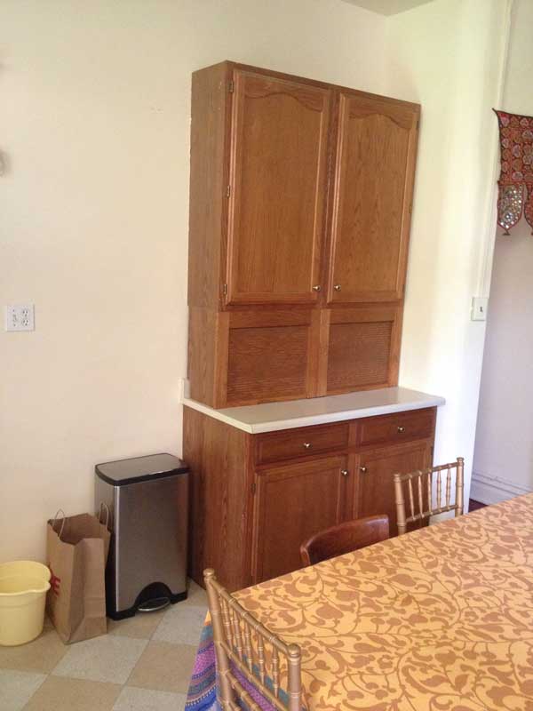 A domino-effect job...inside the upper cabinets in this hutch is the back of a recess in the bathroom wall on the other side. So to remove this, I also have to take out that bathroom shelving and patch the hole.