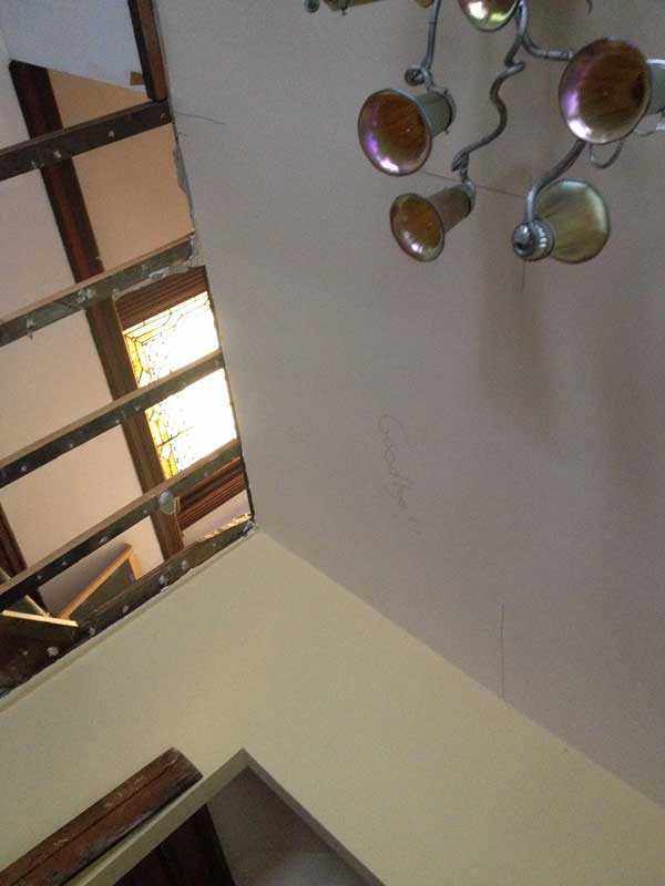 Step 6: Realize there is still a railing to move (above), a floor and the ceiling below it to remove, another wall to tear out and a closet doorway to remove, cut down and relocate.